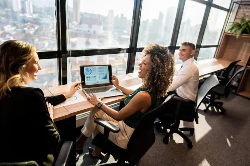 Diverse team of professionals collaborating positively in supportive workplace environment